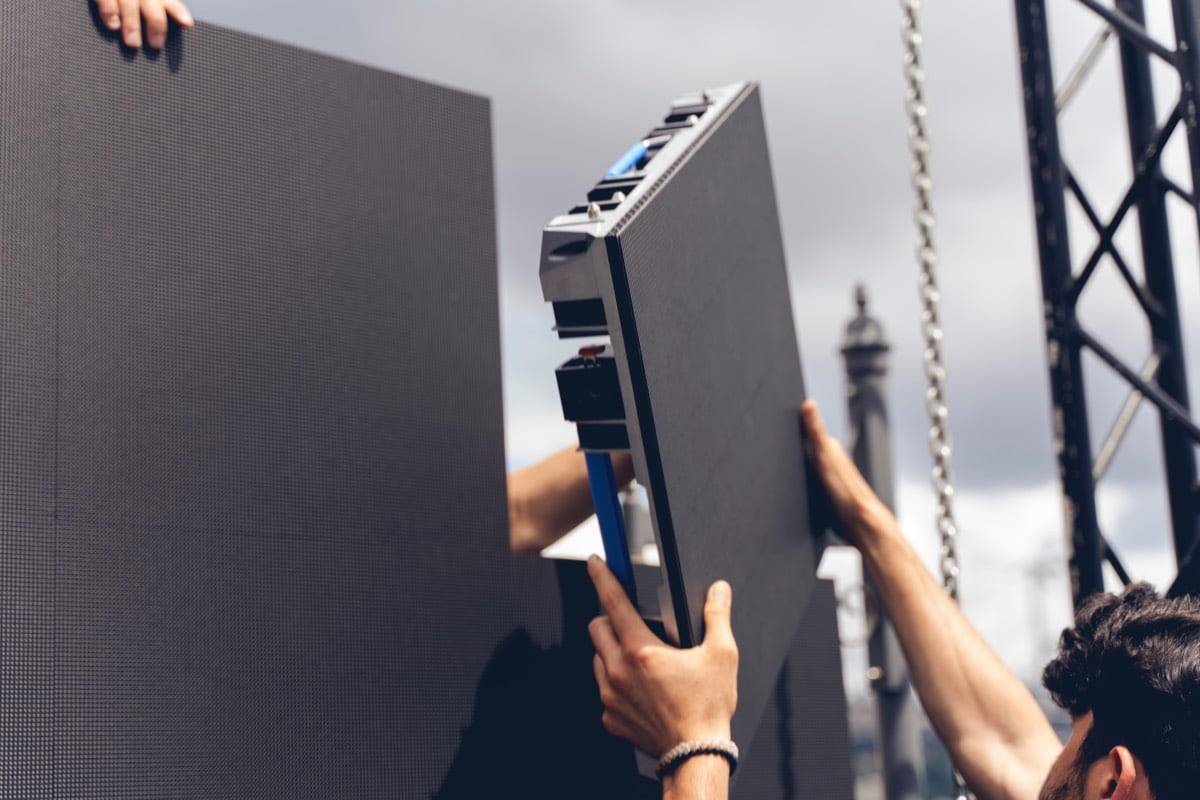 People installing digital led wall panels