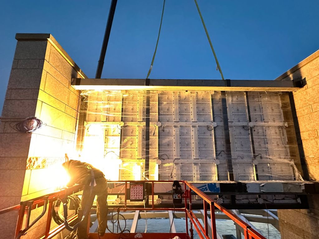 People installing digital led wall panels